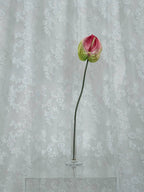 Artificial large anthurium flower by Fleuristic, showcasing vibrant red blooms and lush green leaves in a realistic design.