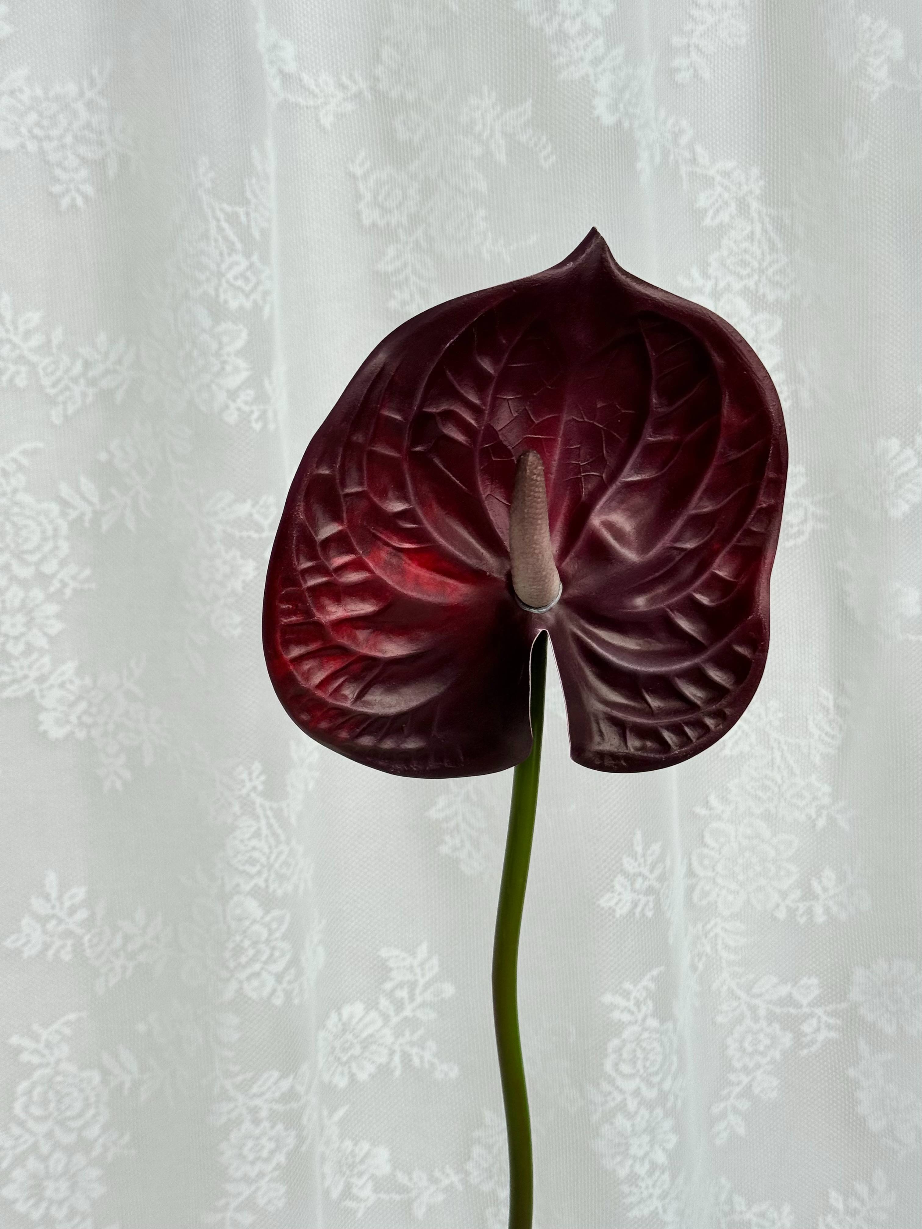 Artificial large anthurium plant by Fleuristic with vibrant red flowers and lush green leaves for decorative use.