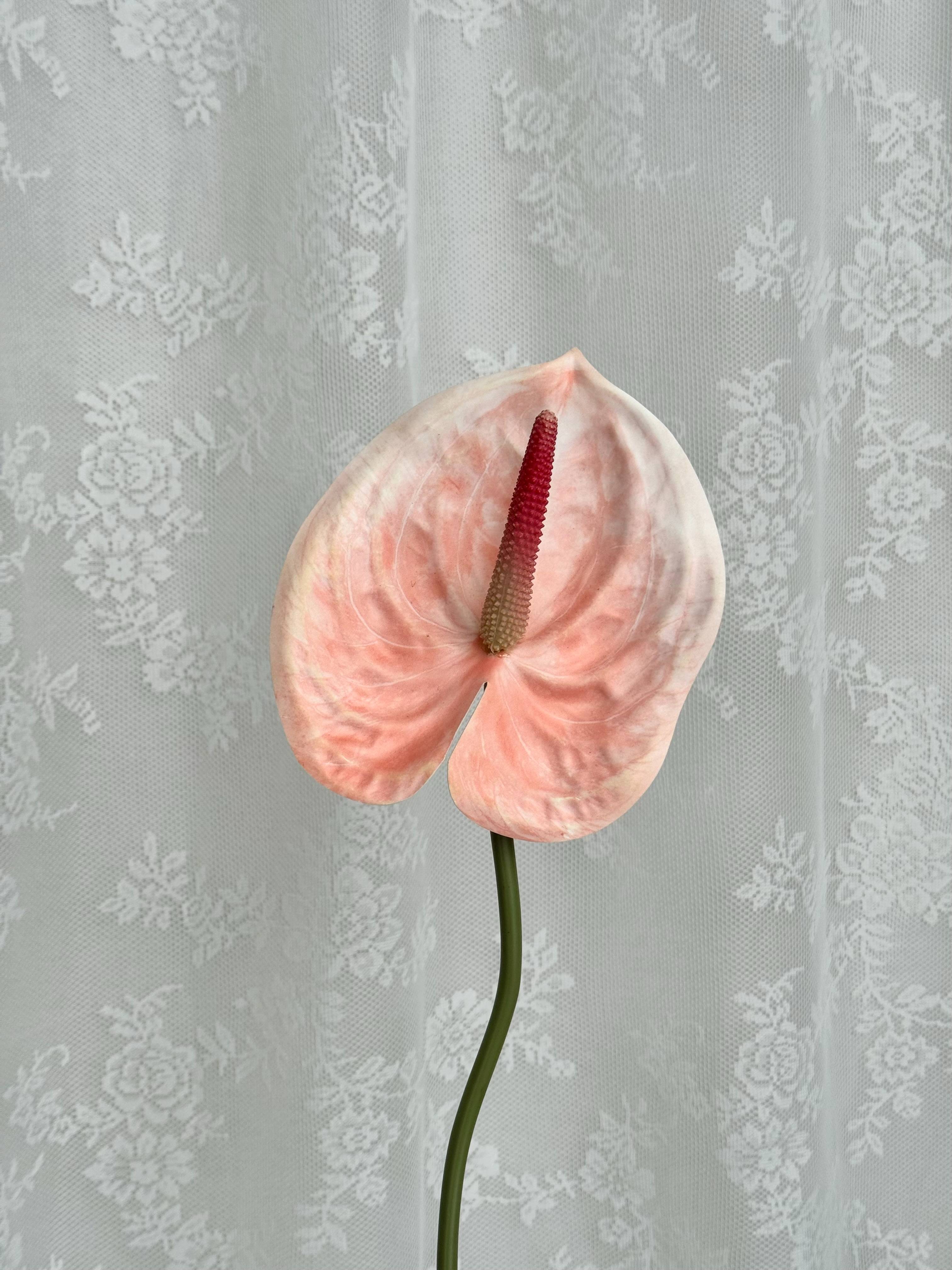 Artificial large anthurium plant by Fleuristic with vibrant red flowers and lush green leaves, perfect for home decor.
