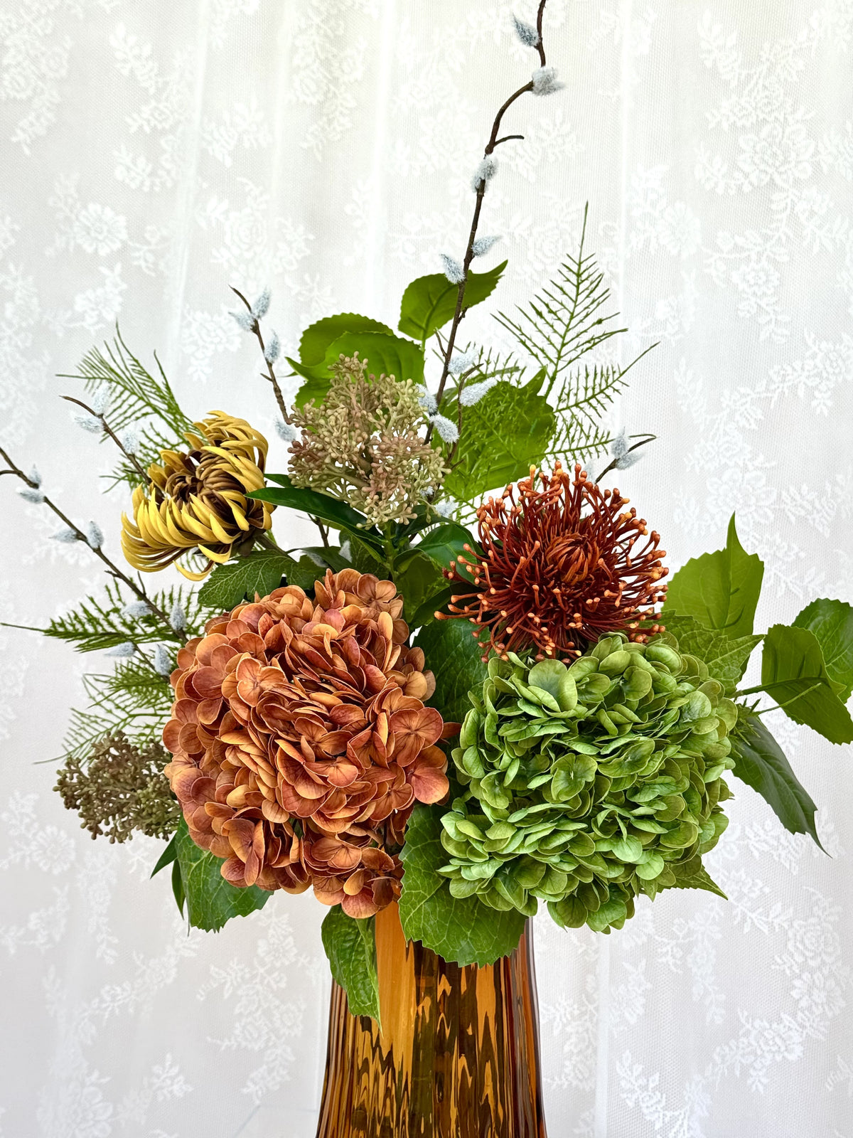 Artificial floral bouquet Amber Bloom by Fleuristic featuring vibrant, realistic flowers in a lush arrangement.