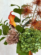 Fleuristic Autumn Affair artificial flower bouquet with warm autumn-colored leaves and foliage in a natural arrangement.