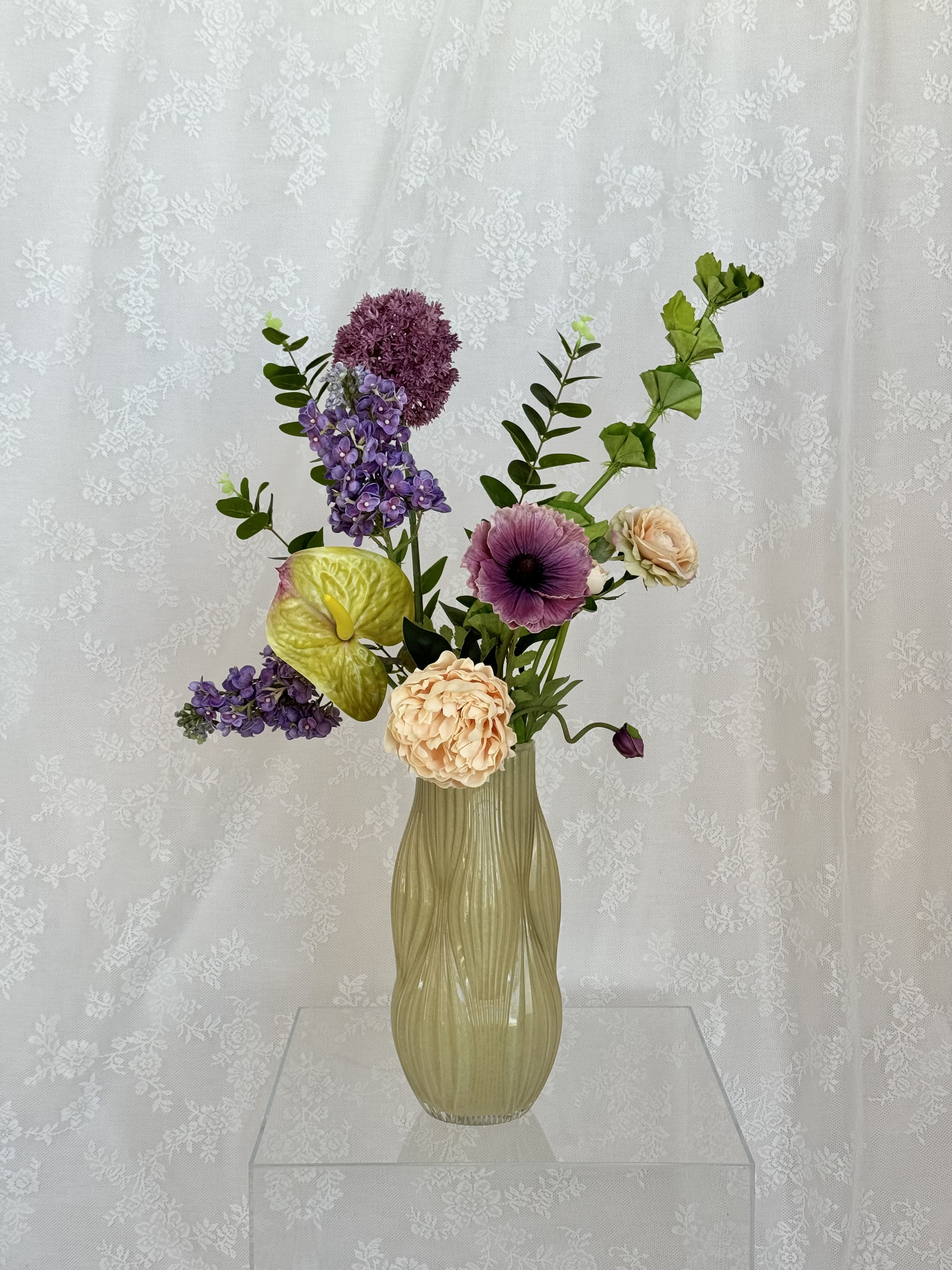 Artificial bouquet of Champagne Harmony flowers by Fleuristic with vibrant, realistic blooms arranged in a stylish display.