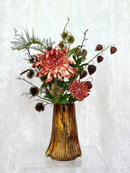 Artificial floral arrangement featuring maple leaves and spice accents in a bouquet by Fleuristic.