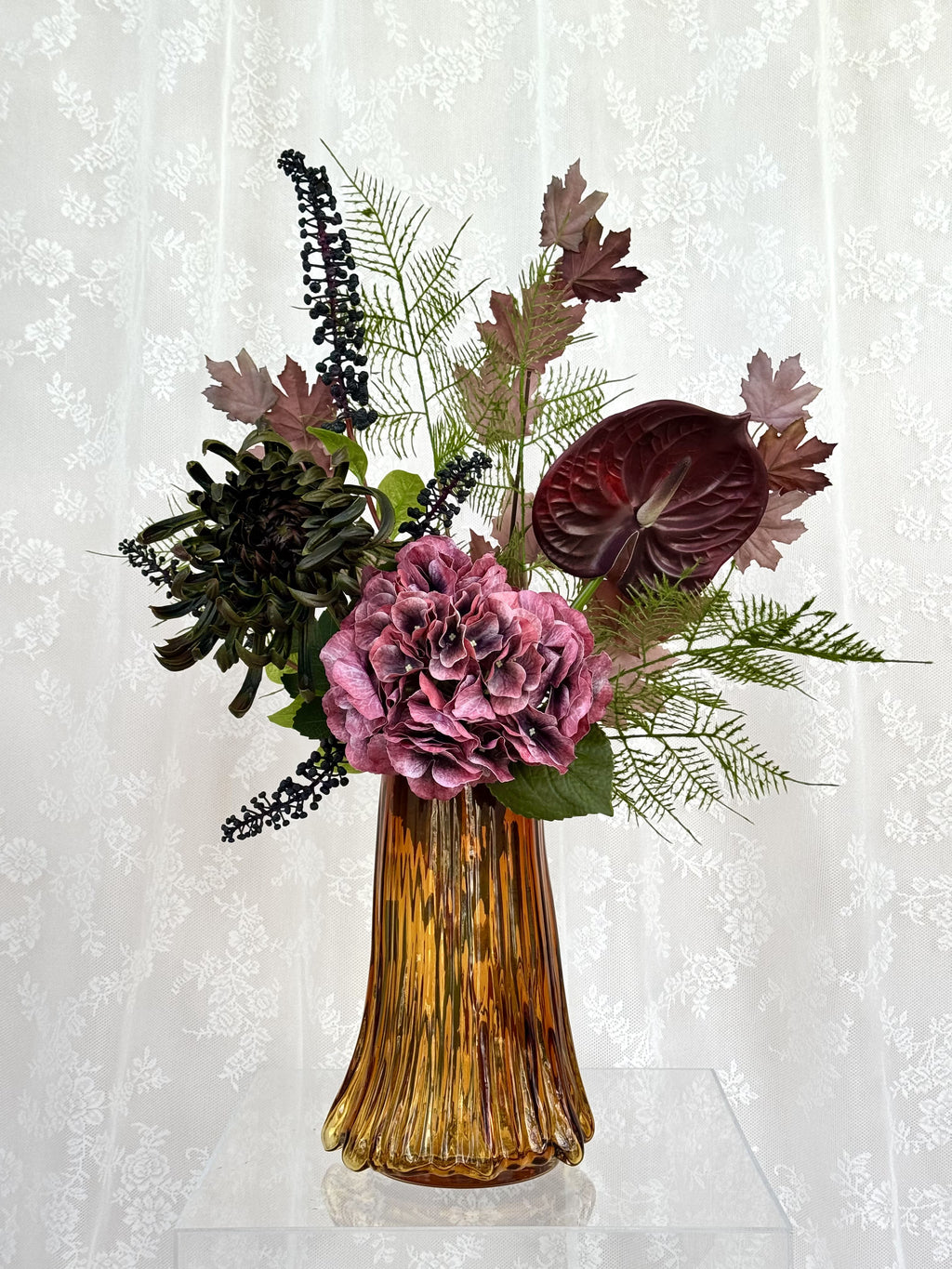 Artificial velvet cherry bouquet by Fleuristic featuring realistic plush red cherries and lush green leaves.