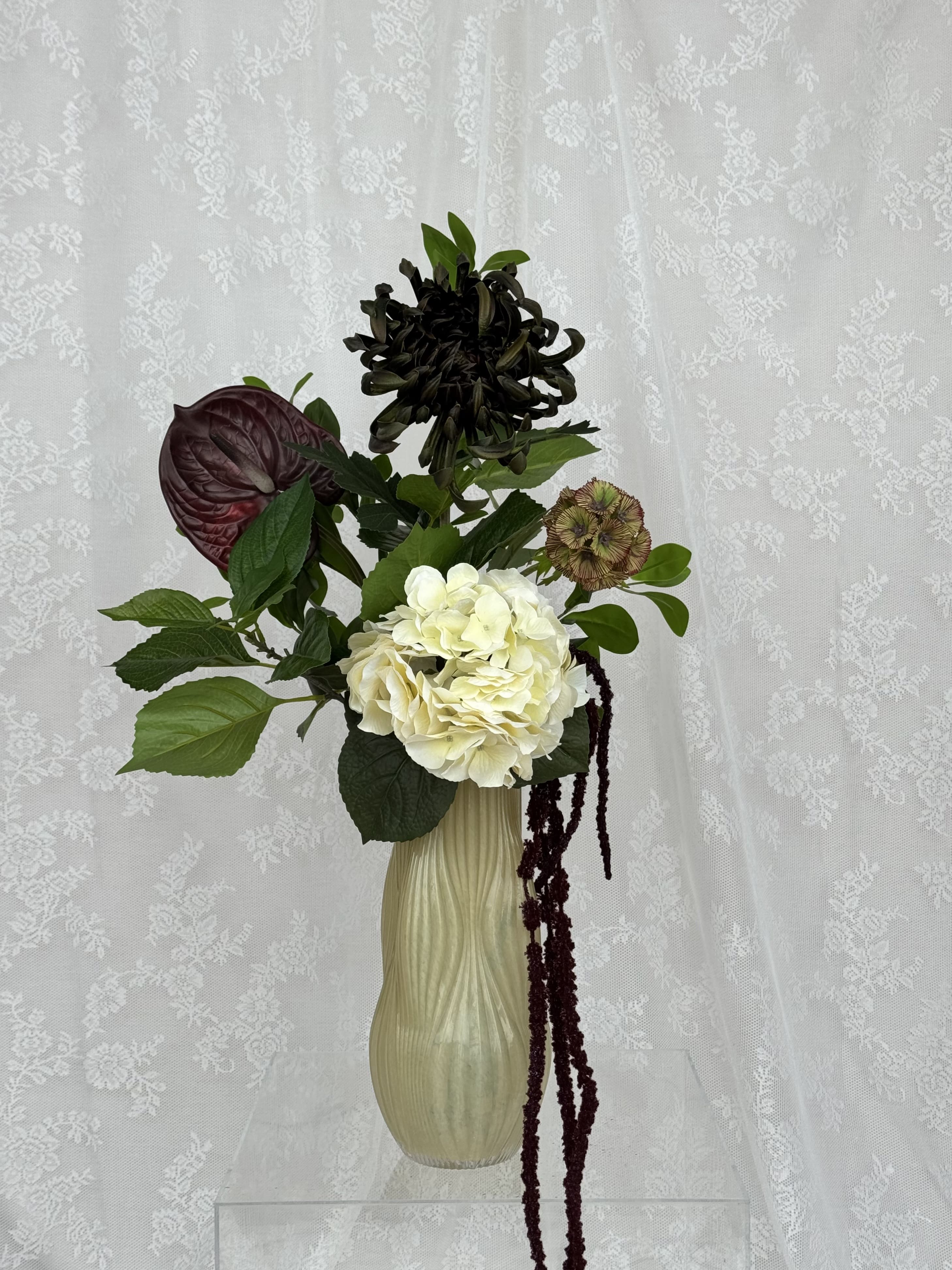 Artificial autumn forest floral arrangement by Fleuristic with vibrant fall foliage and mixed seasonal greenery.