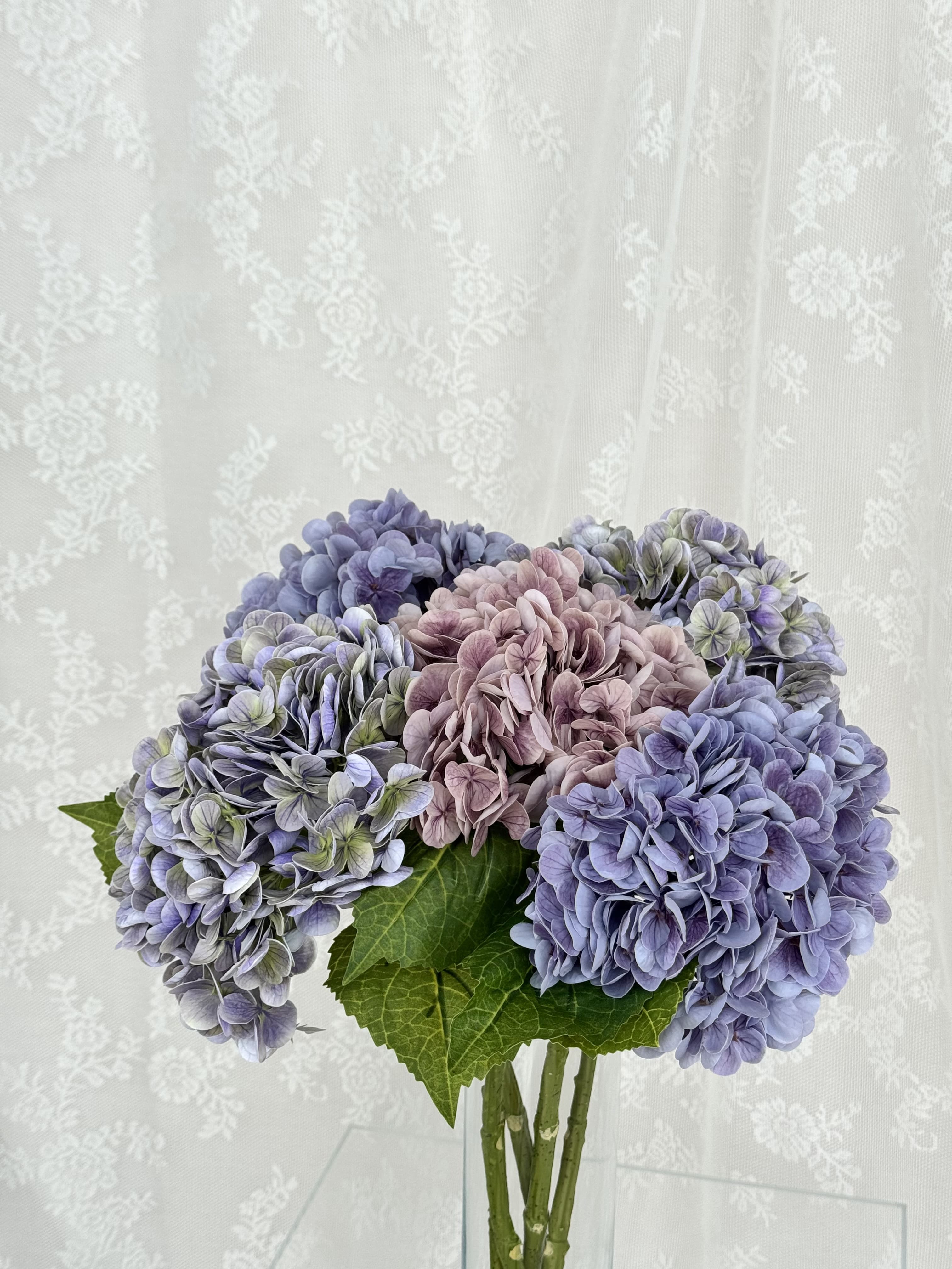 Artificial purple hydrangea flower bouquet by Fleuristic, showcasing vibrant, lifelike blooms in a natural arrangement.