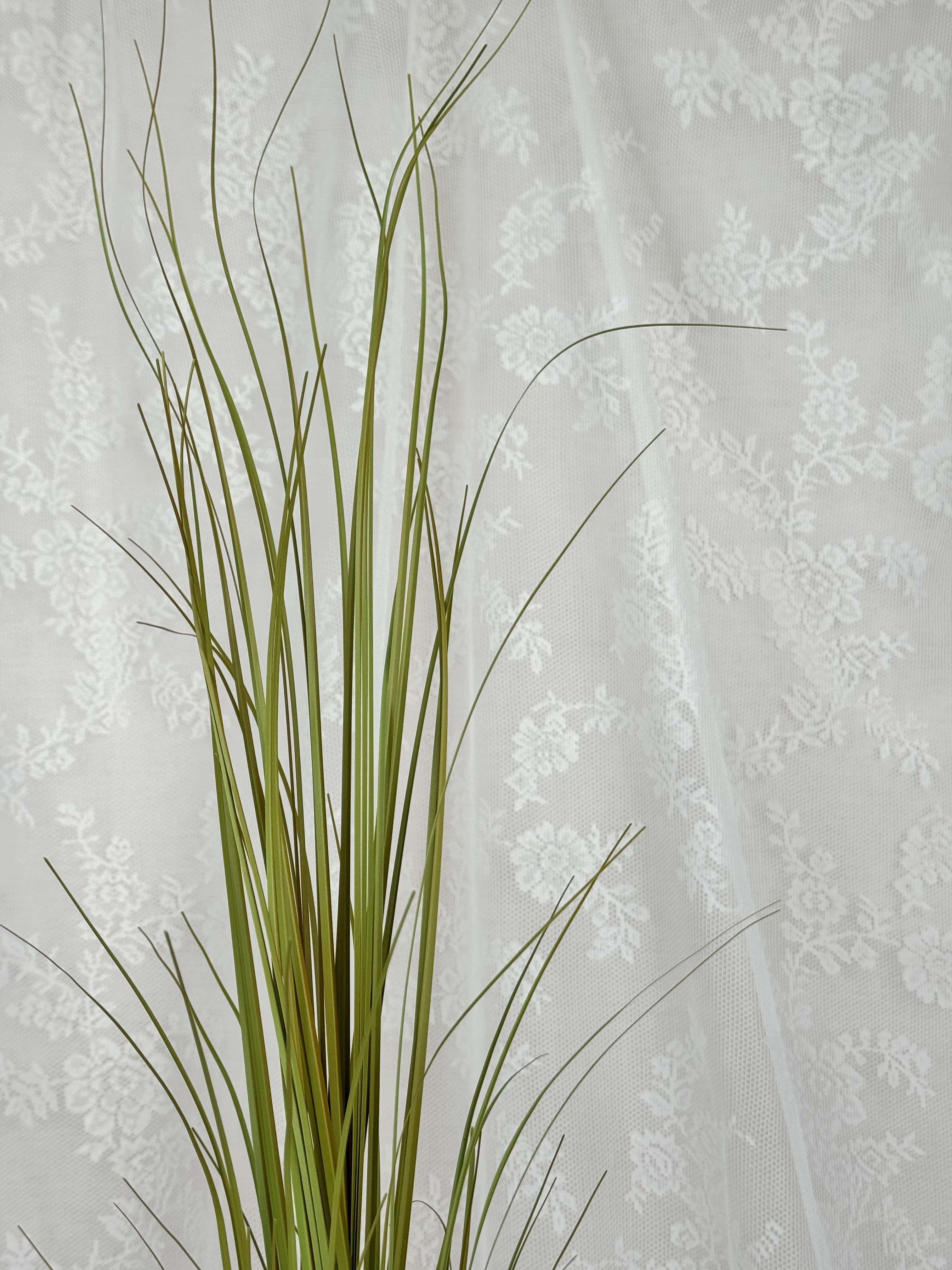 Artificial yellow grass stem from Fleuristic Siv collection, showcasing detailed, vibrant faux greenery for home decor.