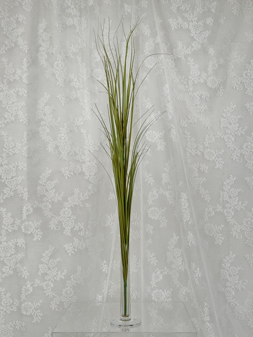 Artificial yellow Siv plant from Fleuristic, with vibrant foliage, suitable for decorative indoor or outdoor use.