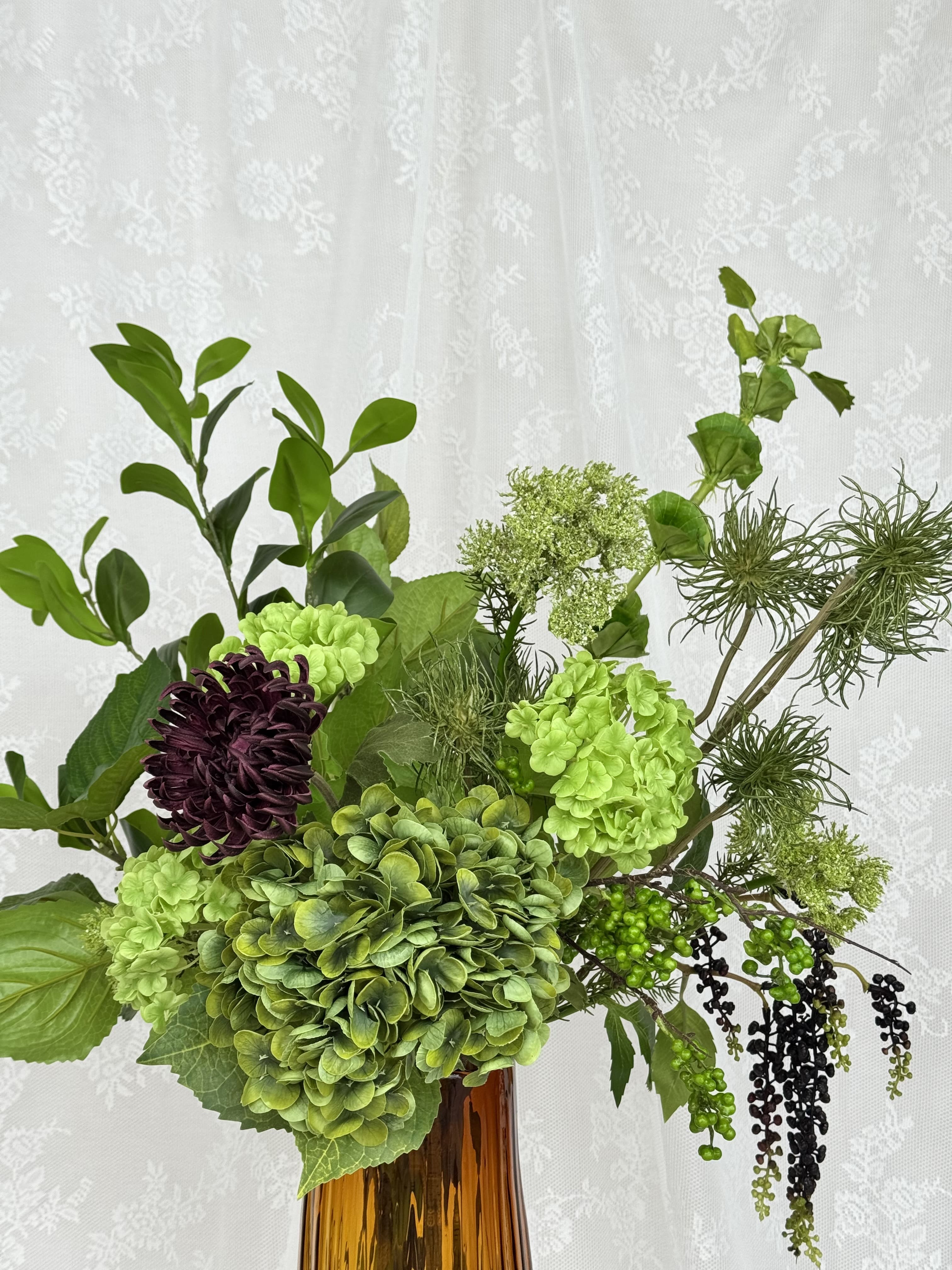 Artificial wild green floral bouquet by Fleuristic featuring lush green leaves and delicate stems for natural decoration.