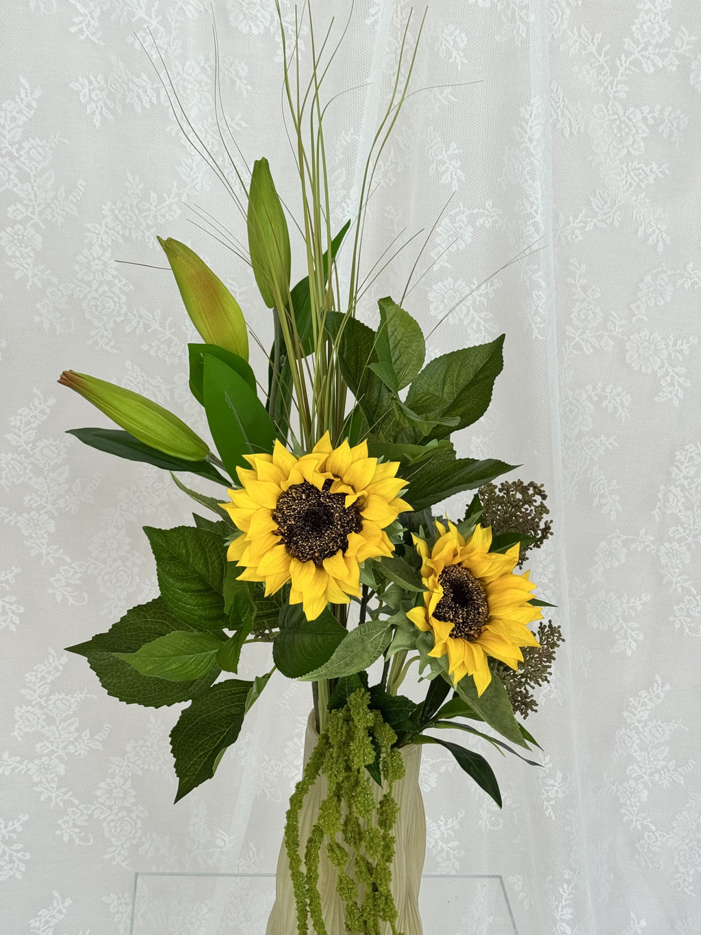 Fleuristic sunflower greens artificial bouquet with vibrant yellow sunflowers and green foliage in a detailed close-up image.