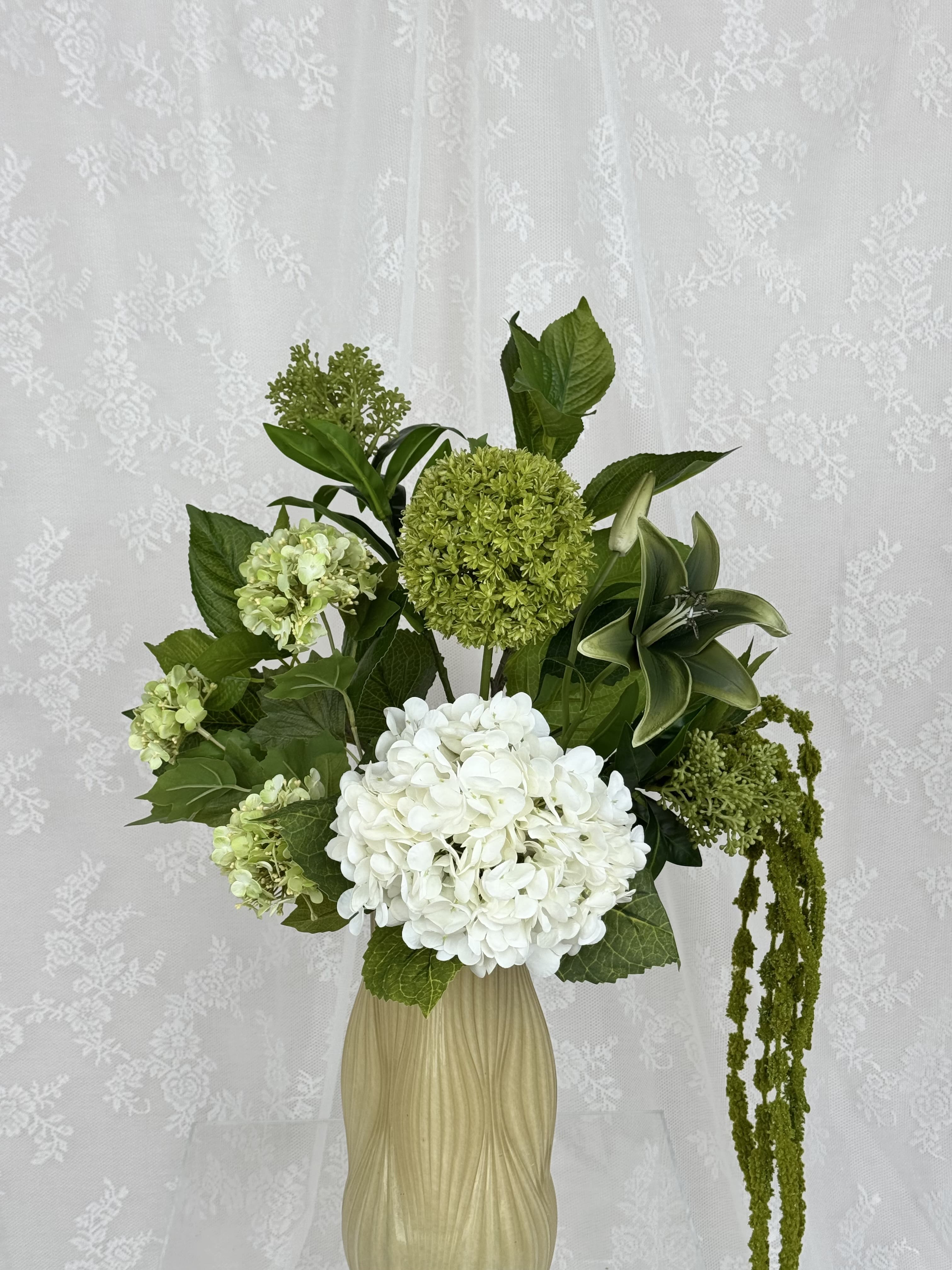 Close-up of Fleuristic Green Classic artificial floral bouquet with lush green leaves and detailed greenery.