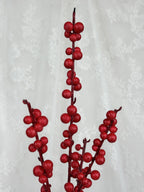 Fleuristic artificial Ilex branch with glossy green leaves, realistic faux plant for decorative home or office use.