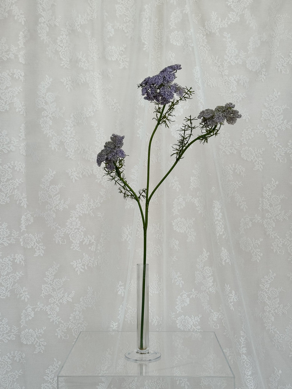 Artificial wild carrot flower by Fleuristic, showing vibrant orange color and natural-looking petals.