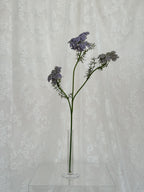 Artificial wild carrot flower by Fleuristic, showing vibrant orange color and natural-looking petals.