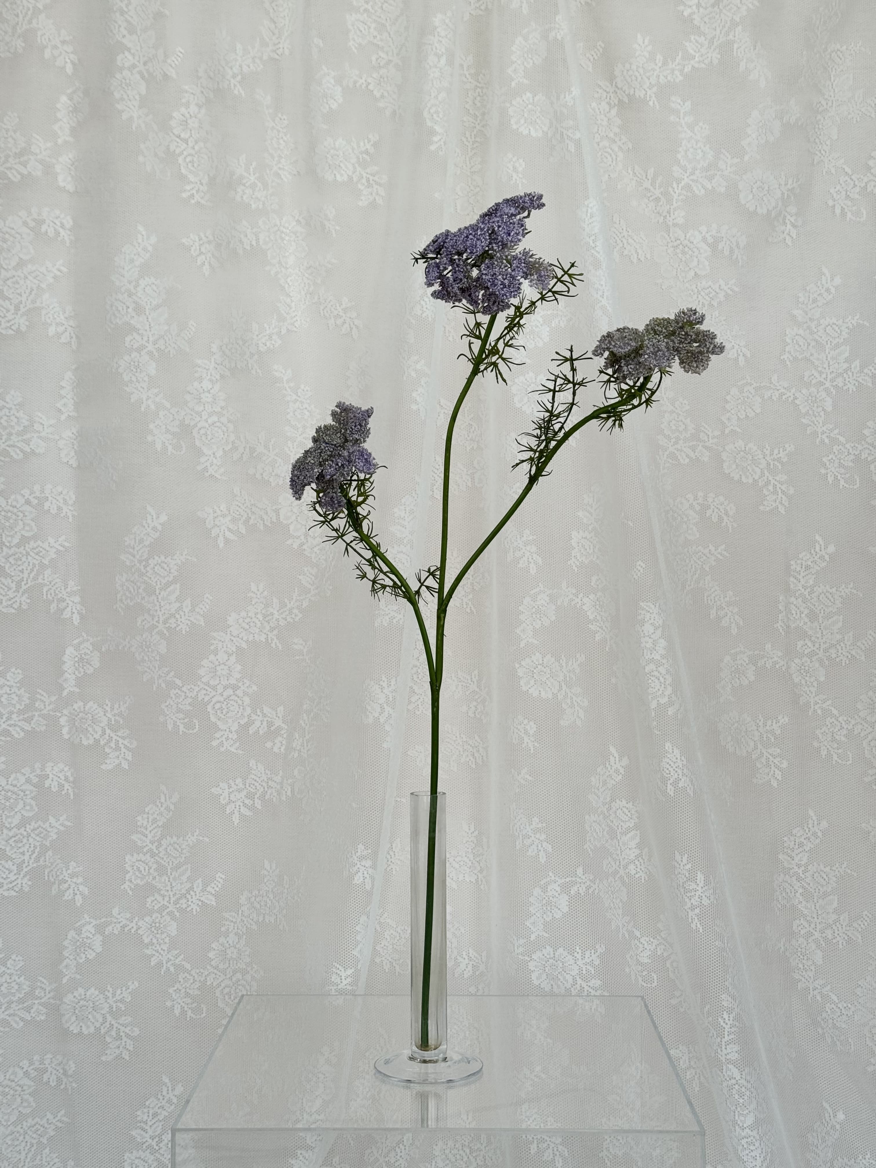 Artificial wild carrot flower by Fleuristic, showing vibrant orange color and natural-looking petals.