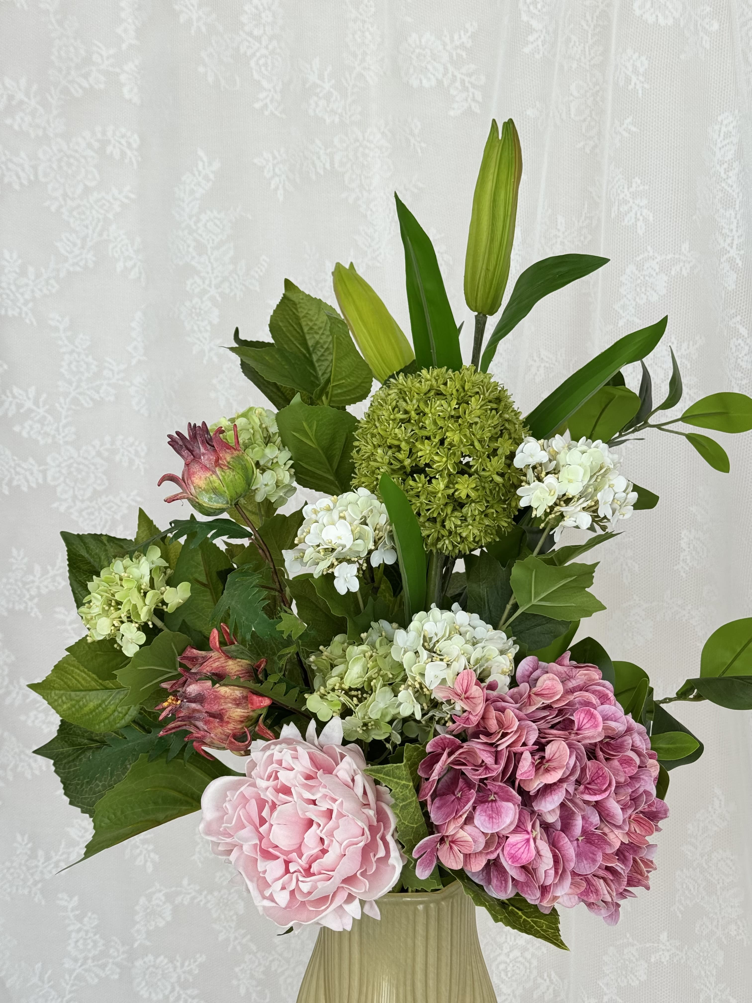 Artificial rosy green spring bouquet by Fleuristic featuring delicate pink and green synthetic flower details.