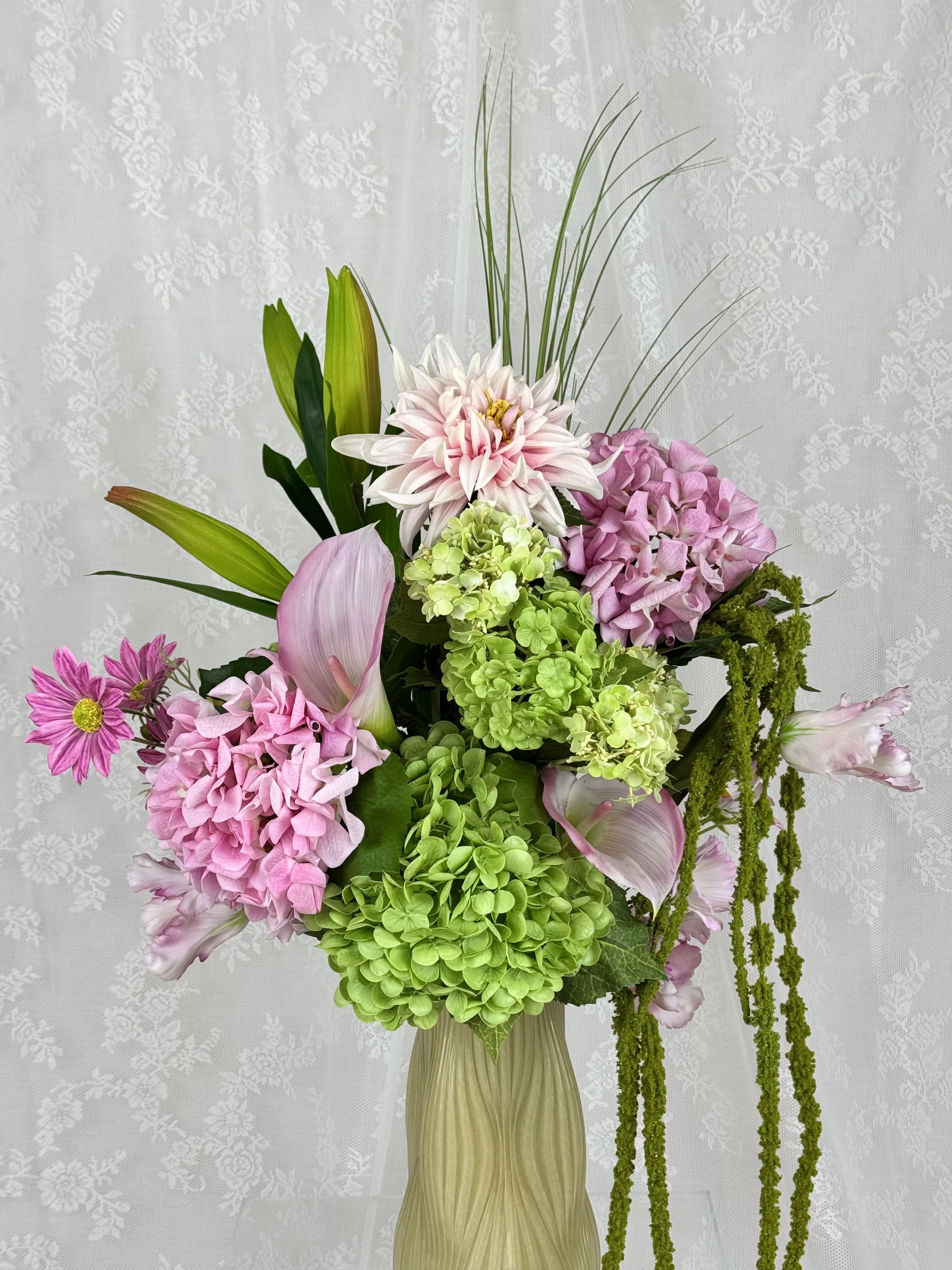 Artificial spring blush bouquet by Fleuristic with soft pink and green floral accents, perfect for spring decor.